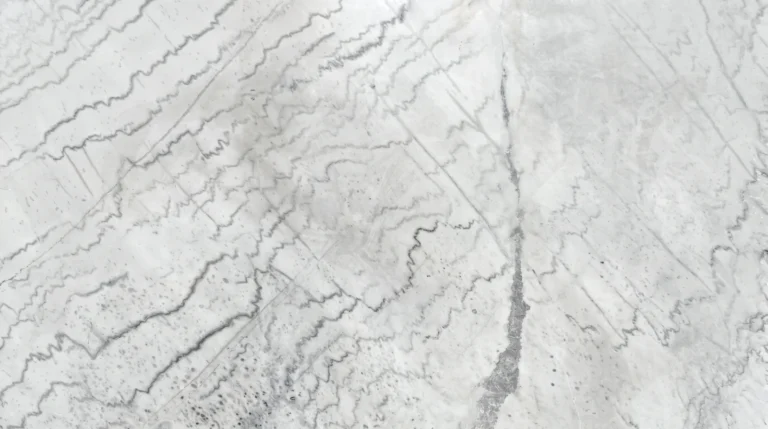 Antique White marble slab, polished finish, white with rippling gray bands and a darker gray vein