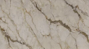 Polished Calacatta Aura quartz slab, warm cream with bronze-gold and brown veins