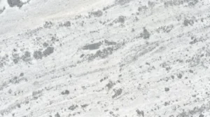 Fantasy White marble slab, polished finish, white with scattered gray patches and soft diagonal movement