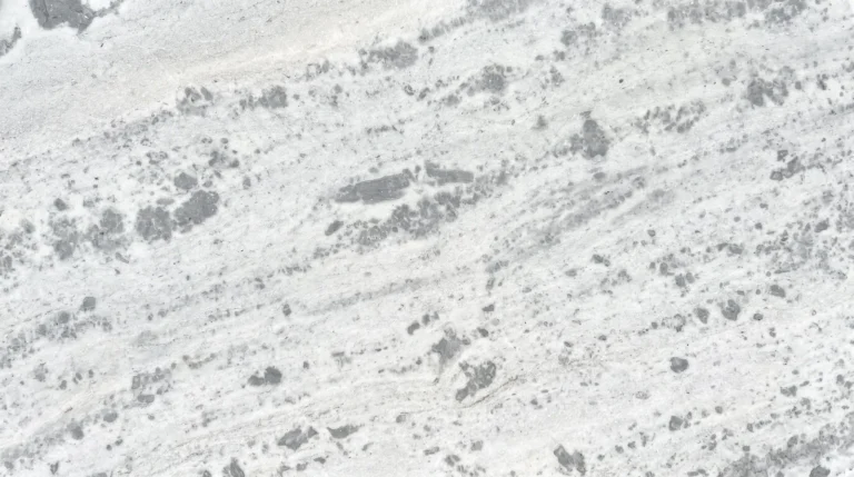 Fantasy White marble slab, polished finish, white with scattered gray patches and soft diagonal movement