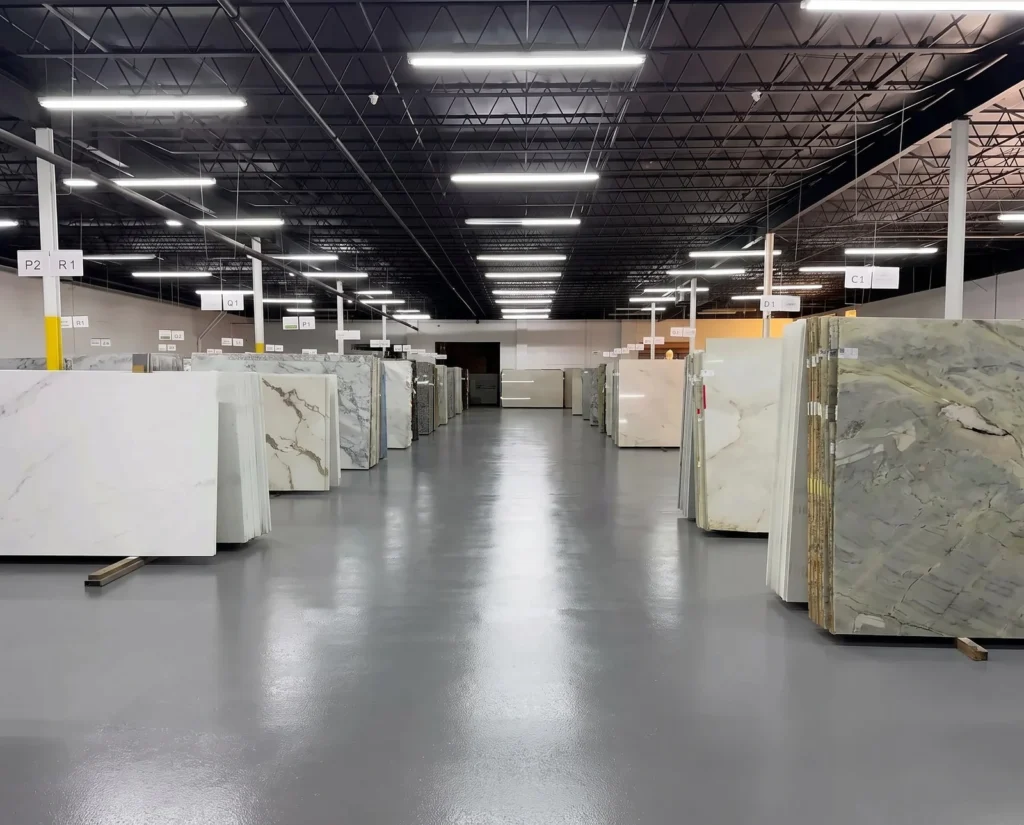 Aisles of granite, quartzite and marble slabs in the GA Granite Atlanta warehouse