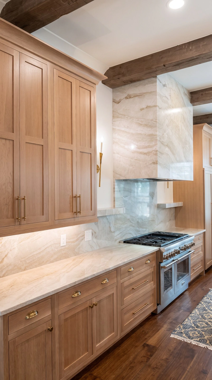 Quartzite countertops and full-height backsplash behind the range