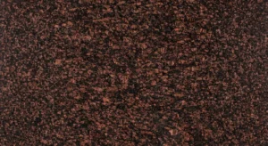 Polished Tan Brown granite slab, near-black with reddish-brown crystals