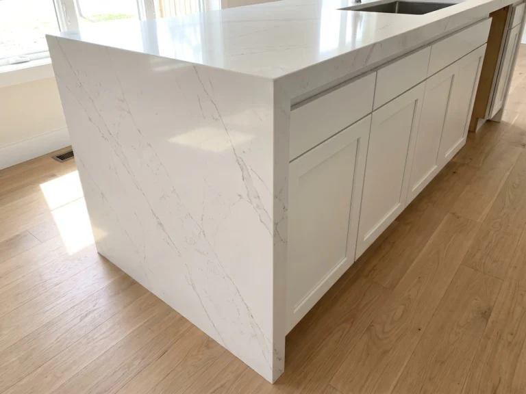 Waterfall countertop edge on white quartz